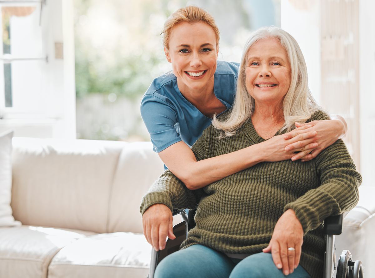 A caregiver with an older woman at home